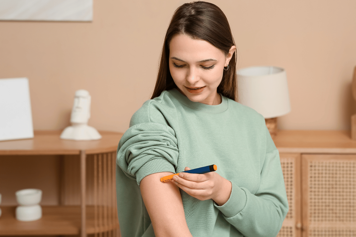 Diabetic Woman Giving Herself Insulin Injection at Home
