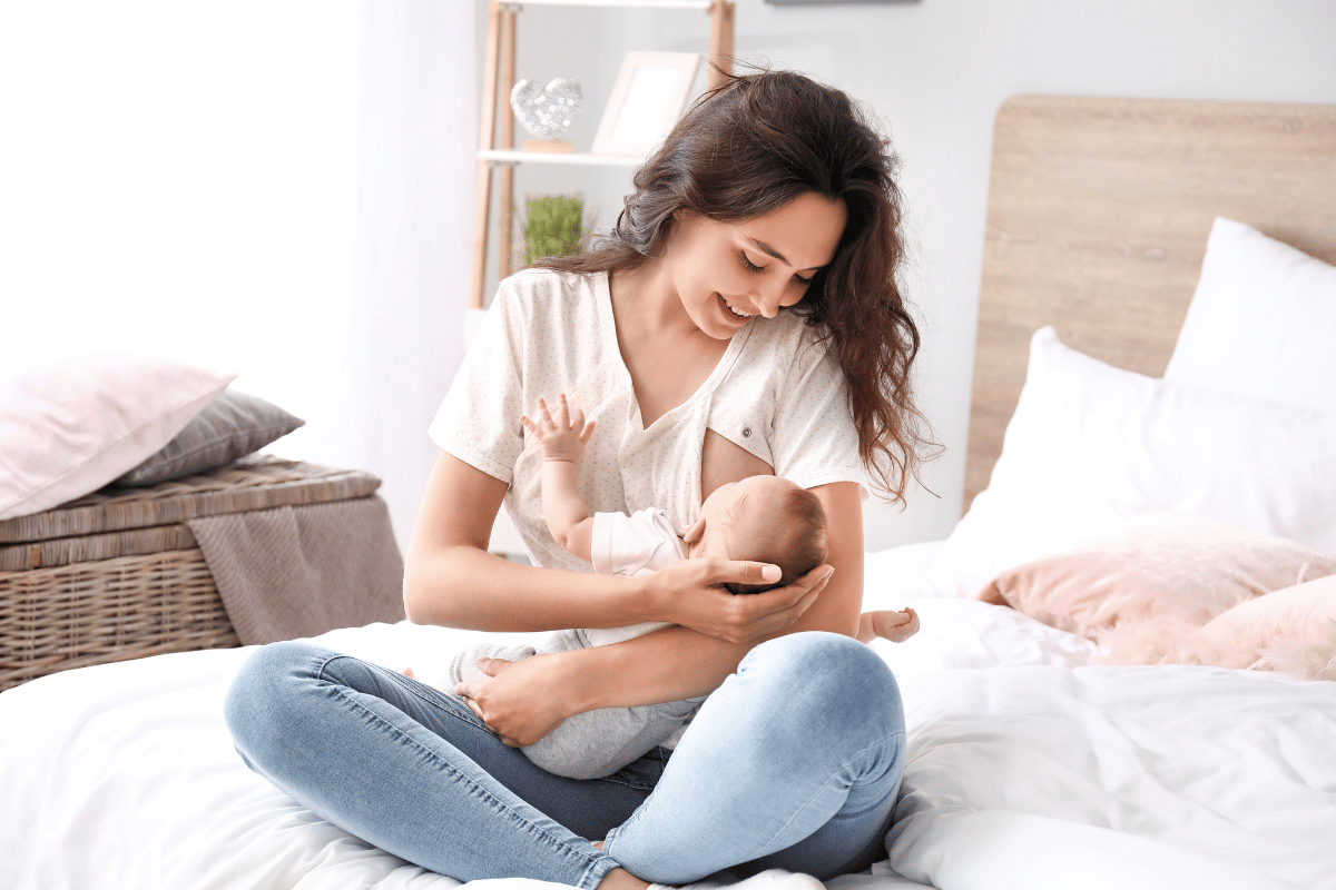 Young Woman Breastfeeding Her Baby at Home