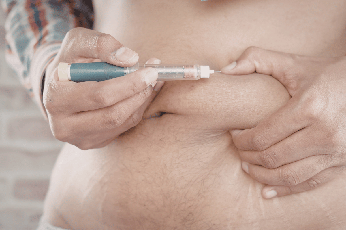 Person administering insulin injection