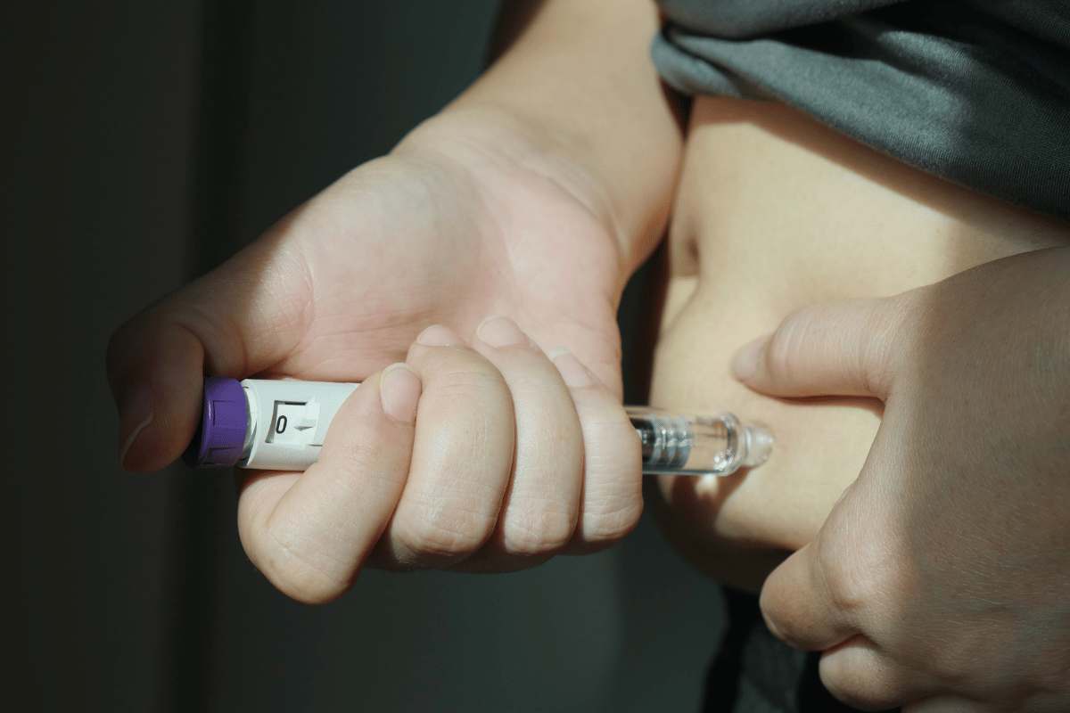 Hand Holding Weight Loss Injection Pen