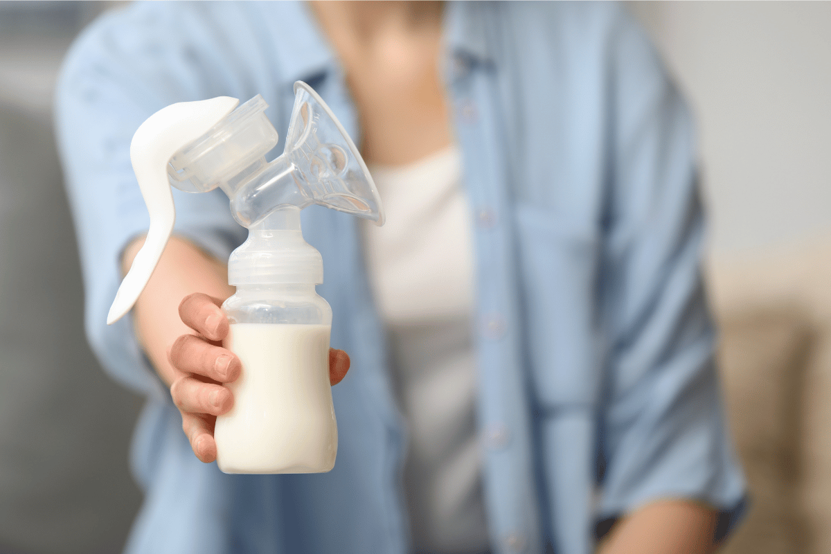 Woman with Breast Pump at Home, Closeup