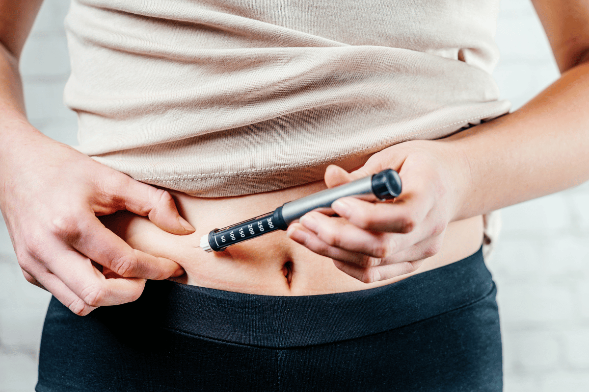 A Woman Injects Insulin with Insulin Injection Device into the Subcutaneous Tissue of Abdomen