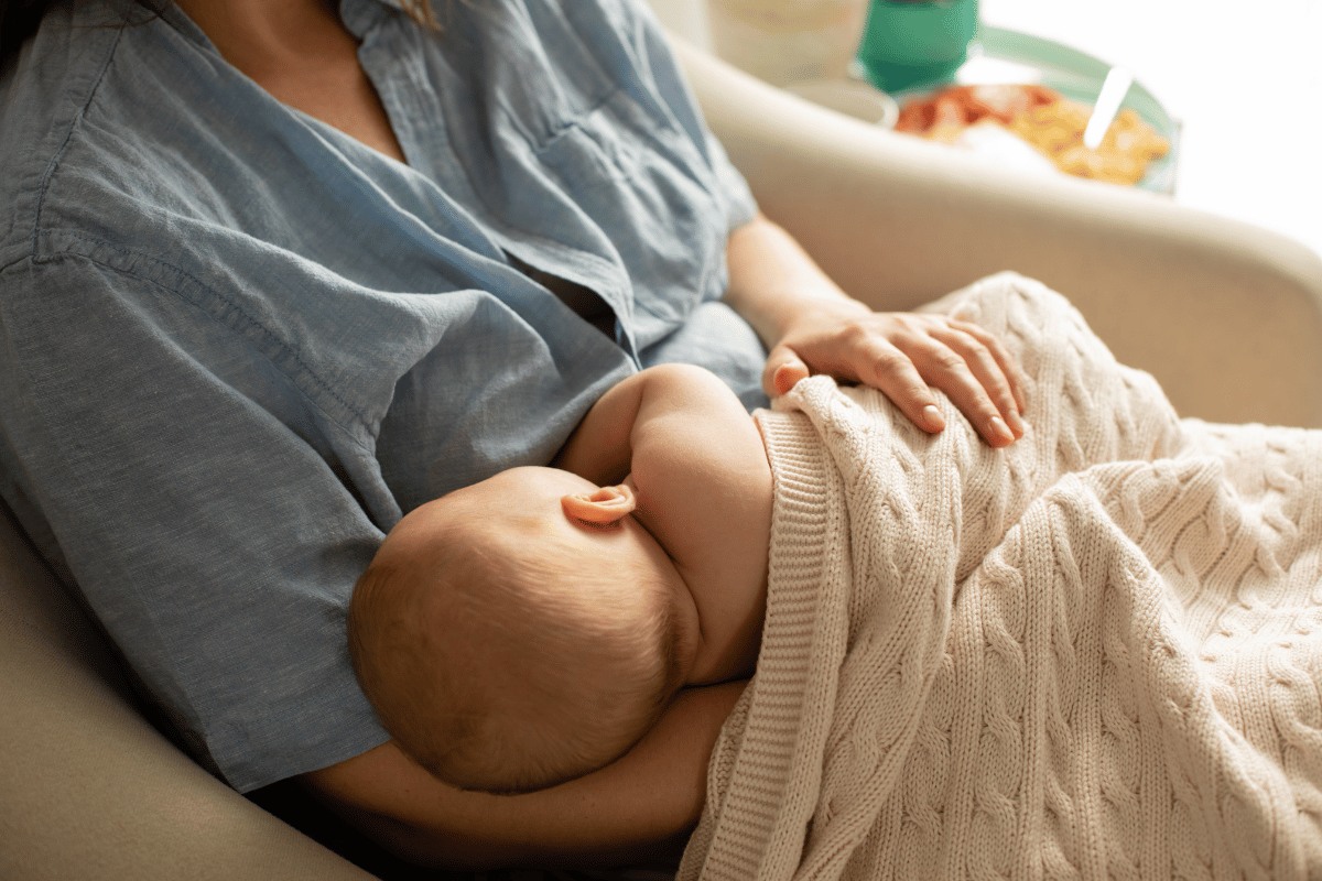 Mom and Newborn Baby Resting after Breastfeeding