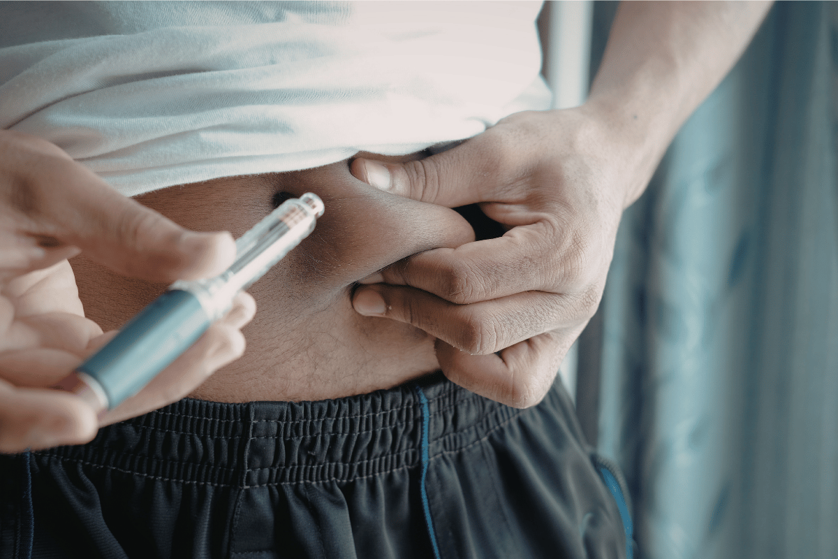 Person administering insulin injection